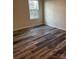 Bedroom featuring vinyl floors, a window and neutral paint at 3258 Killian Rd, Lincolnton, NC 28092