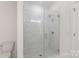 Elegant bathroom featuring frameless glass shower with stylish marble tiling and modern fixtures at 3413 Holabird Ln # 10, Charlotte, NC 28208