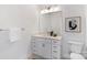 Clean bathroom with a single sink, light fixtures, and a large mirror at 3413 Holabird Ln # 10, Charlotte, NC 28208
