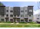 New townhomes featuring modern design, gray accents, and well-maintained front yards at 3413 Holabird Ln # 10, Charlotte, NC 28208