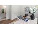 Bright home office with modern desk decor, soft accent pillows, and a view into the en-suite bathroom at 3413 Holabird Ln # 10, Charlotte, NC 28208