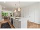 Contemporary kitchen with an island featuring a sink and modern bar stools at 3413 Holabird Ln # 10, Charlotte, NC 28208