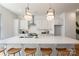 Elegant kitchen with a large island featuring a quartz countertop and barstool seating at 3413 Holabird Ln # 10, Charlotte, NC 28208