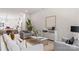 Open living space connecting to the kitchen, with modern furniture and tasteful decorations at 3413 Holabird Ln # 10, Charlotte, NC 28208