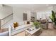 Cozy living room with modern furniture and a view of the staircase to the second level at 3413 Holabird Ln # 10, Charlotte, NC 28208