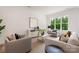 Inviting living room with stylish furniture, light-colored wood floors, and tranquil backyard views at 3413 Holabird Ln # 10, Charlotte, NC 28208