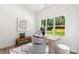 Bright office with a modern desk, bench, chair, and a large window with a backyard view at 3413 Holabird Ln # 10, Charlotte, NC 28208