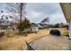 Backyard featuring a patio area, storage shed, and black metal fence at 423 Castlebury Ct, Clover, SC 29710