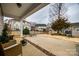 Covered patio in a backyard with a black fence and mature trees at 423 Castlebury Ct, Clover, SC 29710