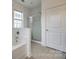 Bathroom with separate shower, tub, and neutral tile flooring at 423 Castlebury Ct, Clover, SC 29710