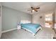 A cozy bedroom with a queen bed, carpeted floors, and a ceiling fan at 423 Castlebury Ct, Clover, SC 29710