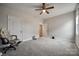 Cozy bedroom with neutral walls, carpet and a ceiling fan at 423 Castlebury Ct, Clover, SC 29710