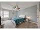 Cozy bedroom with a blue comforter, ceiling fan and carpeted floor at 423 Castlebury Ct, Clover, SC 29710