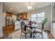 Bright dining area with hardwood floors, view of kitchen, and lots of natural light at 423 Castlebury Ct, Clover, SC 29710