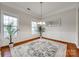 Formal dining room boasts hardwood floors, natural light, and decorative plants at 423 Castlebury Ct, Clover, SC 29710