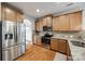 Well-equipped kitchen featuring stainless steel appliances, granite countertops, and ample cabinet space at 423 Castlebury Ct, Clover, SC 29710