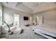 Bright main bedroom featuring trey ceiling, recessed lighting, and doorways to en-suite bathroom at 423 Castlebury Ct, Clover, SC 29710