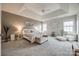 Bright main bedroom featuring trey ceiling, carpet, recessed lighting, and large windows at 423 Castlebury Ct, Clover, SC 29710