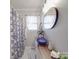 Stylish bathroom featuring a unique vessel sink and a modern shower with a patterned curtain at 4450 Flowes Store Rd, Concord, NC 28025