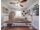 Bright dining room boasts a ceiling fan and a long, wooden table perfect for Gathering gatherings at 4450 Flowes Store Rd, Concord, NC 28025