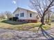 View of the back of a house, showing the yard and surroundings at 4450 Flowes Store Rd, Concord, NC 28025