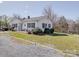 Well maintained house with a sprawling lawn and ample parking at 4450 Flowes Store Rd, Concord, NC 28025