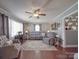 Cozy living room with wood floors and grey furniture at 4450 Flowes Store Rd, Concord, NC 28025