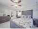 Spacious main bedroom featuring a ceiling fan, wood accents, and ample natural light at 4450 Flowes Store Rd, Concord, NC 28025