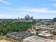 Scenic aerial view of the city skyline surrounded by green trees and buildings at 5003 Tiny Ln, Charlotte, NC 28203