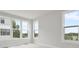 Sunlit bedroom with multiple windows providing great natural lighting and tree top views at 5003 Tiny Ln, Charlotte, NC 28203