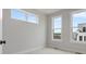 Bright bedroom with three large windows that offer great natural light and views at 5003 Tiny Ln, Charlotte, NC 28203