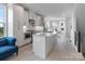 Spacious kitchen featuring stainless steel appliances, a large island with a sink, and light grey cabinetry at 5003 Tiny Ln, Charlotte, NC 28203