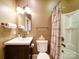 Cozy bathroom with a vanity sink, toilet, and shower featuring updated fixtures at 507 6Th W Ave, Gastonia, NC 28052