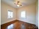 Bedroom featuring wood floors, natural light and ceiling fan providing a versatile space at 507 6Th W Ave, Gastonia, NC 28052