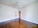 Empty bedroom with hardwood floors, a ceiling fan, and plenty of natural light at 507 6Th W Ave, Gastonia, NC 28052