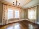 Dining room featuring two windows and hardwood floors, perfect for entertaining at 507 6Th W Ave, Gastonia, NC 28052