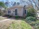 Charming single Gathering home with landscaped front yard, bushes, walkway, and front door at 507 6Th W Ave, Gastonia, NC 28052