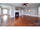 Spacious living room featuring a fireplace, ceiling fan and beautiful hardwood floors at 507 6Th W Ave, Gastonia, NC 28052