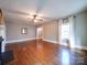 Bright living room with hardwood floors, fireplace, and ample natural light from windows at 507 6Th W Ave, Gastonia, NC 28052