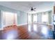 Bright living room with hardwood floors, fireplace, and ample natural light from windows at 507 6Th W Ave, Gastonia, NC 28052