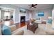 Comfortable living room with seating around the fireplace and access to dining area at 507 6Th W Ave, Gastonia, NC 28052