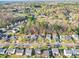 An aerial view of a neighborhood featuring well-maintained homes and lush greenery at 5414 Peachwood Dr, Charlotte, NC 28216