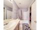 Cozy bathroom featuring neutral tones, a bathtub with shower and a closet at 5414 Peachwood Dr, Charlotte, NC 28216