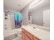 Simple bathroom showcasing a combination tub and shower with colorful curtain at 5414 Peachwood Dr, Charlotte, NC 28216