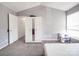 This bedroom features neutral paint, carpeted floors, and a white mirrored wardrobe at 5414 Peachwood Dr, Charlotte, NC 28216