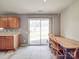 Bright dining area with wood table, chairs, and sliding glass doors leading to backyard at 5414 Peachwood Dr, Charlotte, NC 28216