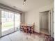 Dining area features a wood table, chairs, and sliding glass doors to the patio at 5414 Peachwood Dr, Charlotte, NC 28216