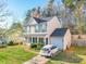 Attractive two-story home with a front-facing garage, features a well-maintained lawn at 5414 Peachwood Dr, Charlotte, NC 28216