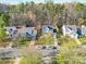 A pleasant street view highlights three attractive single-Gathering homes with well-kept lawns and driveways at 5414 Peachwood Dr, Charlotte, NC 28216