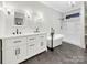 Bathroom featuring a double vanity, soaking tub, and modern fixtures at 6141 Creft Cir, Indian Trail, NC 28079